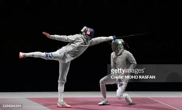 Italy's Luca Curatoli compete against South Korea's Gu Bongil in the men's sabre team gold medal bout during the Tokyo 2020 Olympic Games at the...