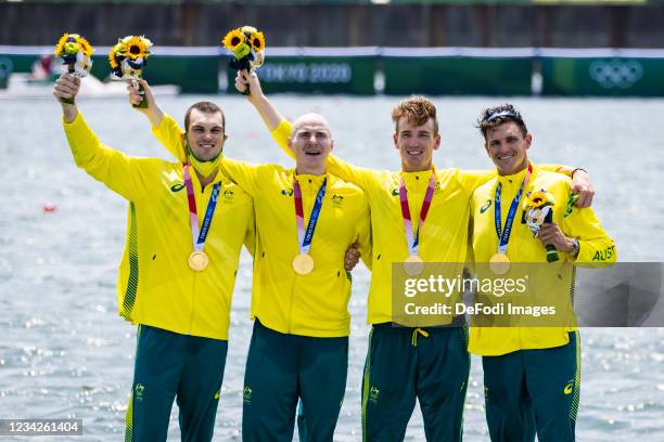 Alexander Purnell of Australia, Spencer Turrin of Australia, Jack Hargreaves of Australia and Alexander Hill of Australia lie in the water during the...