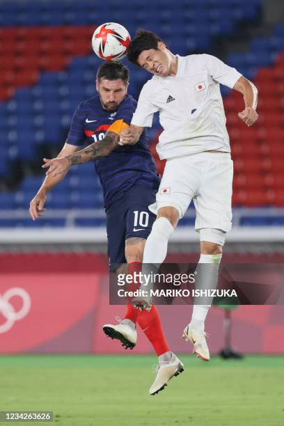 France's forward Andre-Pierre Gignac fights for the ball with Japan's defender Hiroki Sakai during the Tokyo 2020 Olympic Games men's group A first...