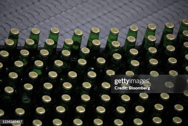 Bottles of Stella Artois brand beer move along the production line at the Anheuser-Busch Budweiser bottling facility in St. Louis, Missouri, U.S., on...