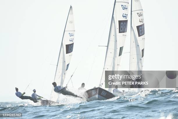 Brazil's Fernanda Oliveira and Ana Barbachan compete in the women's two-person dinghy 470 race 1 during the Tokyo 2020 Olympic Games sailing...