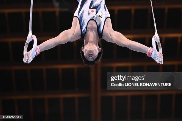 Japan's Daiki Hashimoto competes in the rings event of the artistic gymnastics men's all-around final during the Tokyo 2020 Olympic Games at the...