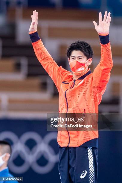 Daiki Hashimoto of Japan celebrates at the medal ceremony during Artistic Gymnastics on day five of the Tokyo 2020 Olympic Games at Ariake Gymnastics...