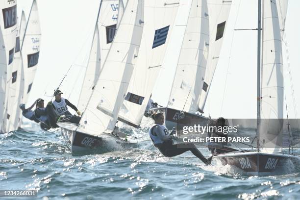 Brazil's Fernanda Oliveira and Ana Barbachan compete in the women's two-person dinghy 470 race 1 during the Tokyo 2020 Olympic Games sailing...