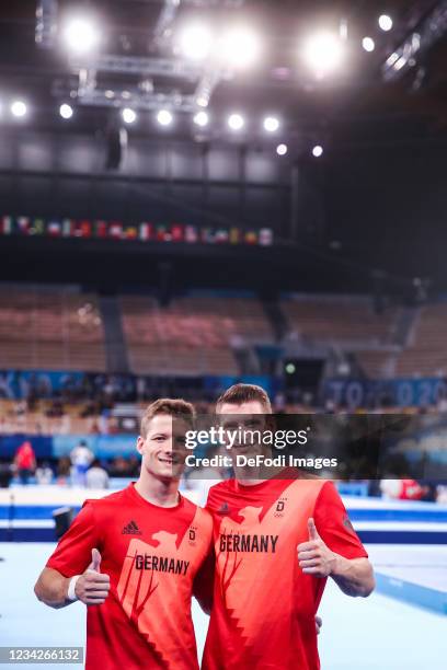 Philipp Herder of Germany and Lukas Dauser of Germany compete during Artistic Gymnastics on day five of the Tokyo 2020 Olympic Games at Ariake...