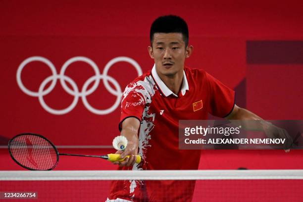 China's Chen Long hits a shot to Spain's Pablo Abian in their men's singles badminton group stage match during the Tokyo 2020 Olympic Games at the...