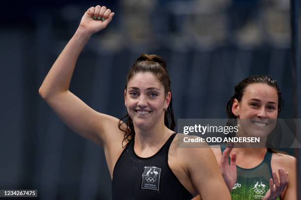 Australia's Brianna Throssell and Meg Harris celebrate winning a heat for the women's 4x200m freestyle relay swimming event during the Tokyo 2020...