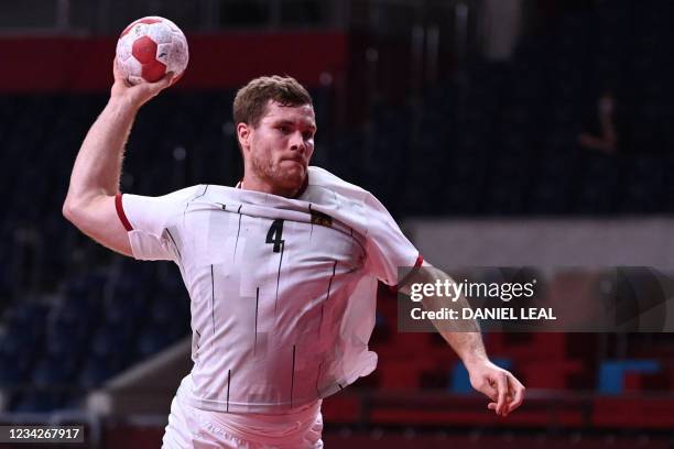 Germany's pivot Johannes Golla shoots during the men's preliminary round group A handball match between France and Germany of the Tokyo 2020 Olympic...