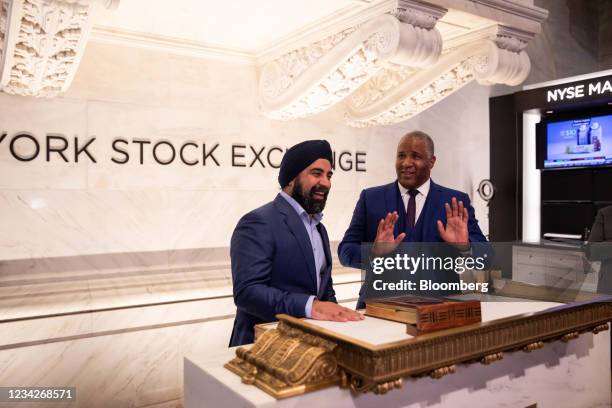 Hardeep Gulati, chief executive officer of PowerSchool, center, talks with Robert Smith, founder, chairman and chief exectuive officer of Vista...