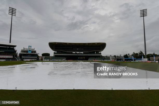 Covers are on as rain delays the start of the 1st T20I between West Indies and Pakistan at Kensington Oval, Bridgetown, Barbados, on July 28, 2021.