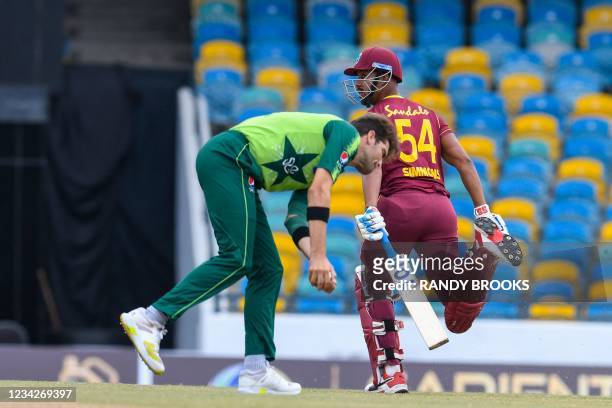 Lendl Simmons of West Indies runs as Shareen Afridi of Pakistan takes the ball during the 1st T20I between West Indies and Pakistan at Kensington...