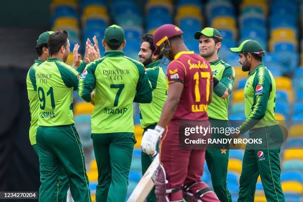 Hasan Ali , Shareen Afridi and Shadab Khan of Pakistan celebrate the dismissal of Evin Lewis of West Indies during the 1st T20I between West Indies...