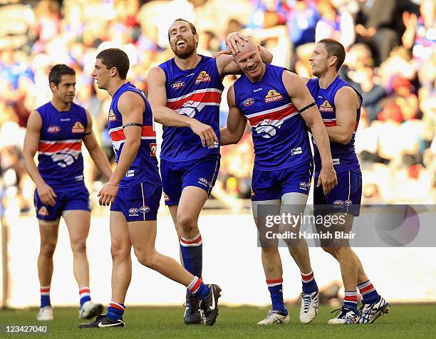 Barry Hall of the Bulldogs celebrates a goal with team mate Ben Hudson during the round 24 AFL match between the Western Bulldogs and the Fremantle...