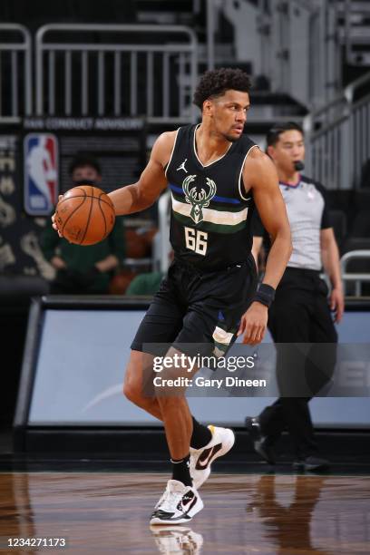 Axel Toupane of the Milwaukee Bucks handles the ball during the game against the China Women's National Team on April 9, 2021 at the Fiserv Forum...