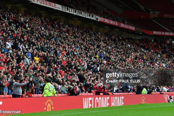 Manchester United's supporters wait for the start of the English Premier League pre-season friendly football match between Manchester United and...