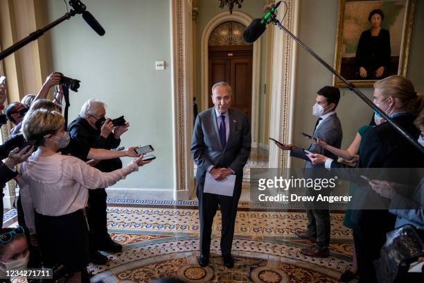 Senate Majority Leader Chuck Schumer speaks briefly to reporters after a meeting with Senate Democrats at the U.S. Capitol on July 28, 2021 in...