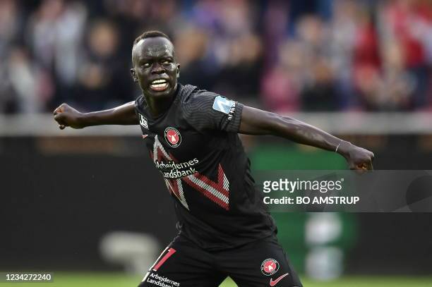 Midtjylland's Australian midfielder Awer Mabil celebrates scoring 1-1 during the UEFA Champions League second round qualifying football match between...