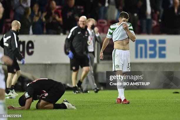 Celtic's Scottish midfielder Ryan Christie reacts at the end of the UEFA Champions League second round qualifying football match between FC...