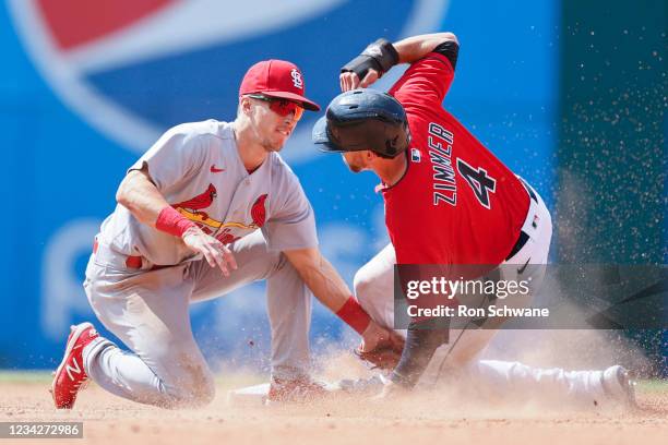 Tommy Edman of the St. Louis Cardinals tags out Bradley Zimmer of the Cleveland Indians attempting to steal second base during the seventh inning at...