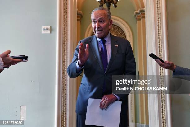Senate Majority Leader Chuck Schumer addresses the press on the infrastruture package at the US Capitol, in Washington, DC on July 28, 2021. - The US...