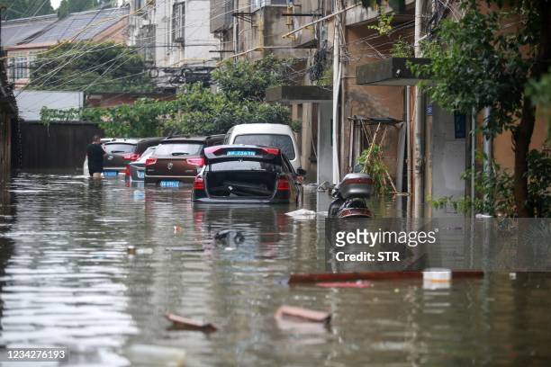 This photo taken on July 28, 2021 shows a flooded street in Yangzhou, in China's eastern Jiangsu province, after heavy rains brought by the passage...