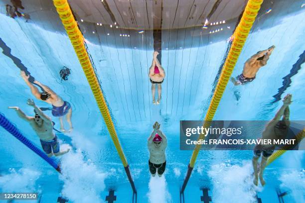 An underwater view shows USA's Caeleb Dressel , Russia's Kliment Kolesnikov, and Italy's Alessandro Miressi in the final of the men's 100m freestyle...