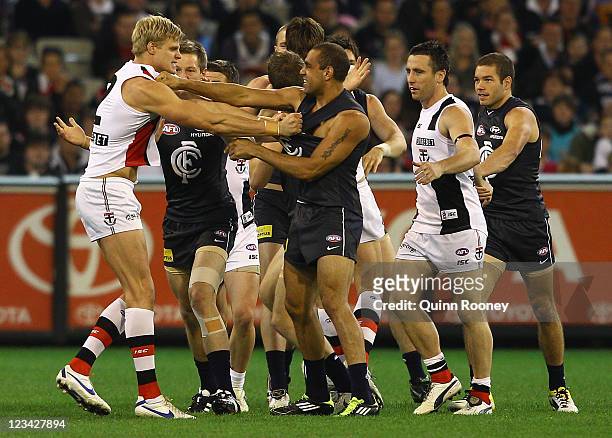 Nick Riewoldt of the Saints and Chris Yarran of the Blues wrestle during the round 24 AFL match between the Carlton Blues and the St Kilda Saints at...
