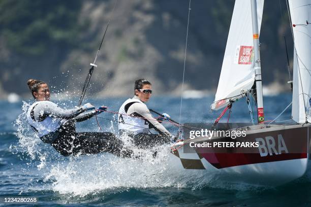 Brazil's Ana Luiza Barbachan and Fernanda Oliveira compete in the women's two-person dinghy 470 race during the Tokyo 2020 Olympic Games sailing...