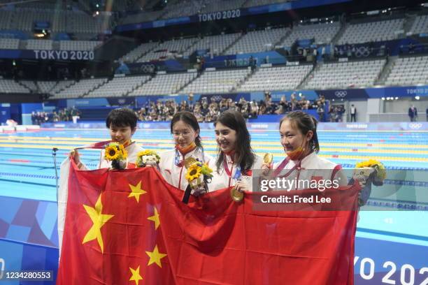 Gold medalists Junxuan Yang, Yufei Zhang, Bingjie Li and Muhan Tang of Team China pose with their gold medals for the Women's 4 x 200m Freestyle...