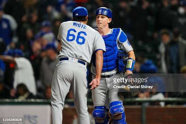 Mitch White of the Los Angeles Dodgers celebrates with Will Smith after winning the game between the Los Angeles Dodgers and the San Francisco Giants...