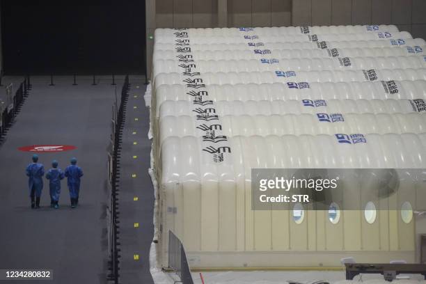 This photo taken on July 28, 2021 shows a temporary "Fire Eye" laboratory used for Covid-19 coronavirus testing at an exhibition centre in Nanjing in...