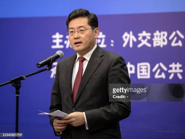 This photo taken on December 25, 2013 shows then director of the Foreign Ministry Information Department of China Qin Gang speaking during an event...