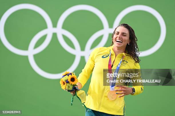 Australia's Jessica Fox poses with her gold medal on the podium following the women's Canoe final during the Tokyo 2020 Olympic Games at Kasai Canoe...