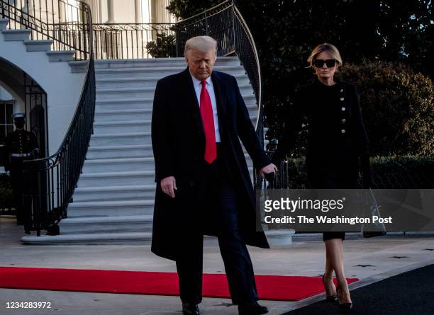 January 20: President Donald Trump, left, and First Lady Melania Trump depart the White House for the last time in Washington, DC.