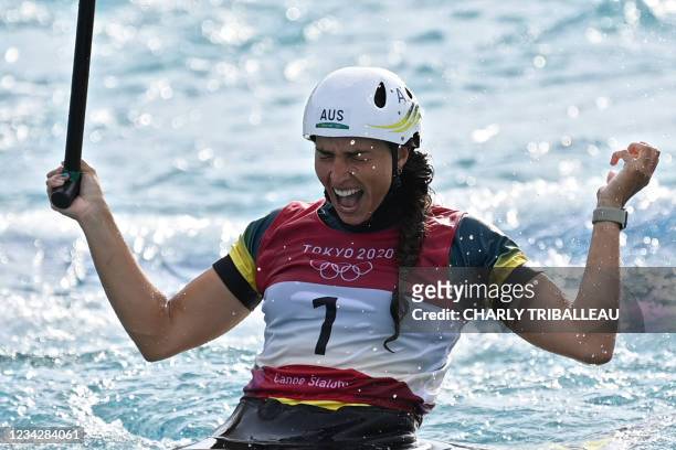 Australia's Jessica Fox celebrates winning the women's Canoe final during the Tokyo 2020 Olympic Games at Kasai Canoe Slalom Centre in Tokyo on July...