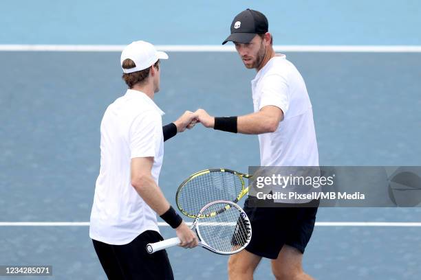 Michael Venus of Team New Zealand and Marcus Daniell of Team New Zealand play Ivan Dodig of Team Croatia and Marin Cilic of Team Croatia during their...