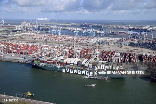 An aerial view shows the container ship Ever Given arrives at the ECT Delta terminal in the port of Rotterdam, early on 29 July 2021. - The container...