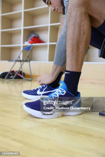 Devin Booker of the USA Men's National Team laces up his sneakers prior to practice as part of the 2020 Tokyo Olympics on July 29, 2021 in Tokyo,...