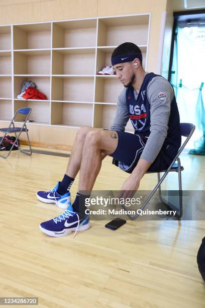 Devin Booker of the USA Men's National Team laces up his sneakers prior to practice as part of the 2020 Tokyo Olympics on July 29, 2021 in Tokyo,...