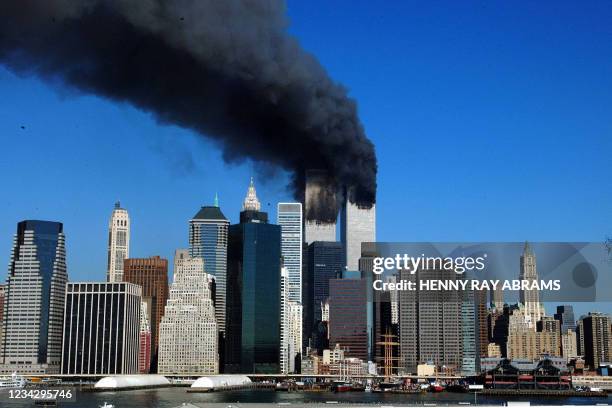 The twin towers of the World Trade Center billow smoke after hijacked airliners crashed into them early 11 September, 2001. The suspected terrorist...