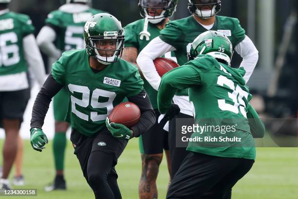 Lamarcus Joyner and Sharrod Neasman of the New York Jets work out during a morning practice at Atlantic Health Jets Training Center on July 29, 2021...