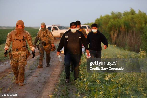 Group of illegal immigrants consisting of Mexicans and Central Americans are caught by the U.S. Border Patrol, Rio Grande Valley Sector, after...