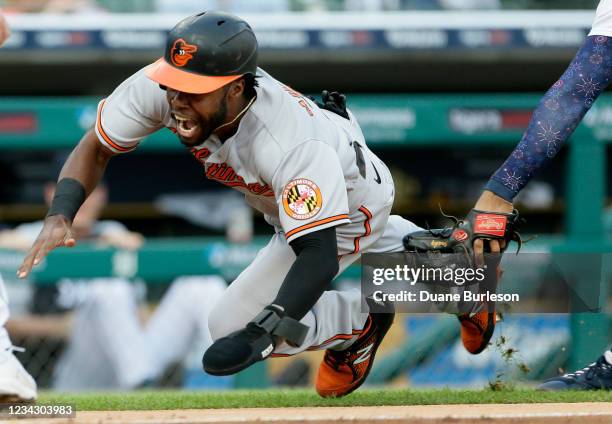 Cedric Mullins of the Baltimore Orioles is tagged out by Jeimer Candelario of the Detroit Tigers while trying to score when caught in a rundown...