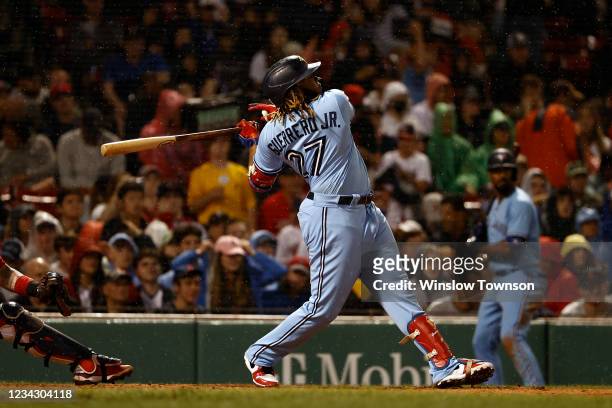 Vladimir Guerrero Jr. #27 of the Toronto Blue Jays follows through on a three-run home run against the Boston Red Sox during the fifth inning at...