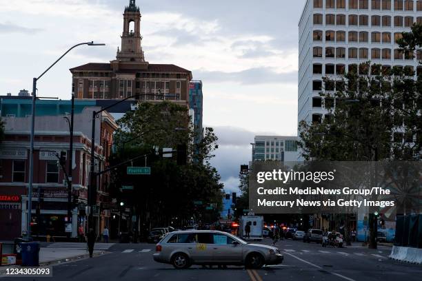 Car is left in the middle of East Santa Clara Street following a protest decrying the police killing of George Floyd in downtown San Jose on Friday,...