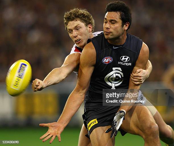 Zac Dawson of the Saints spoils a mark by Setanta O'Hailpin of the Blues during the round 24 AFL match between the Carlton Blues and the St Kilda...