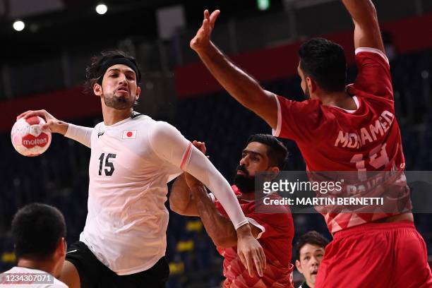 Japan's left back Adam Yuki Baig jumps to shoot during the men's preliminary round group B handball match between Bahrain and Japan of the Tokyo 2020...