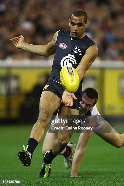 Chris Yarran of the Blues kicks during the round 24 AFL match between the Carlton Blues and the St Kilda Saints at the Melbourne Cricket Ground on...