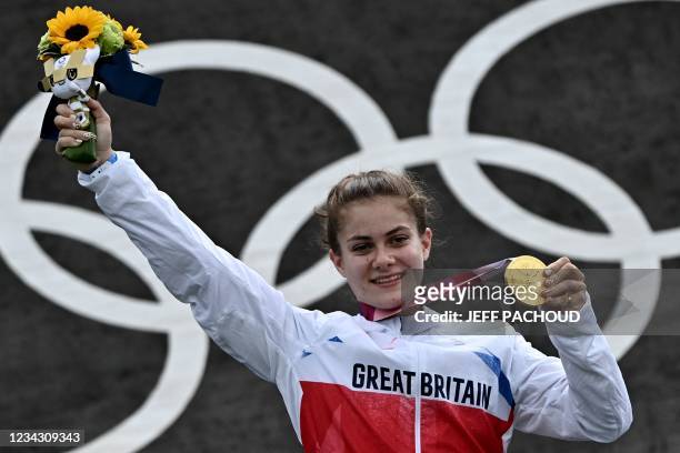 Gold medallist Britain's Bethany Shriever celebrates on the podium for the victory ceremony for the cycling BMX racing women's event at the Ariake...
