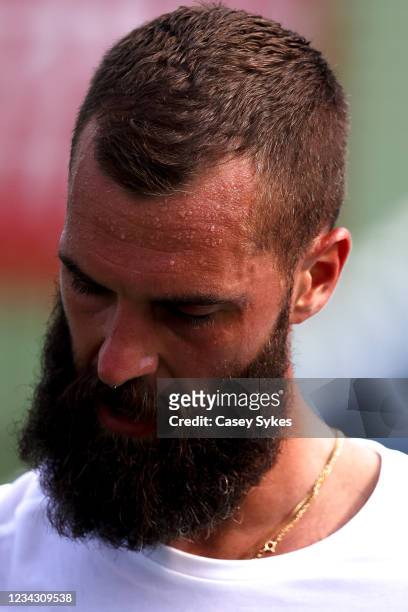 Sweat is seen on the forehead of Benoit Paire of France during a match against Emil Ruusuvuori of Finland at the Truist Atlanta Open at Atlantic...